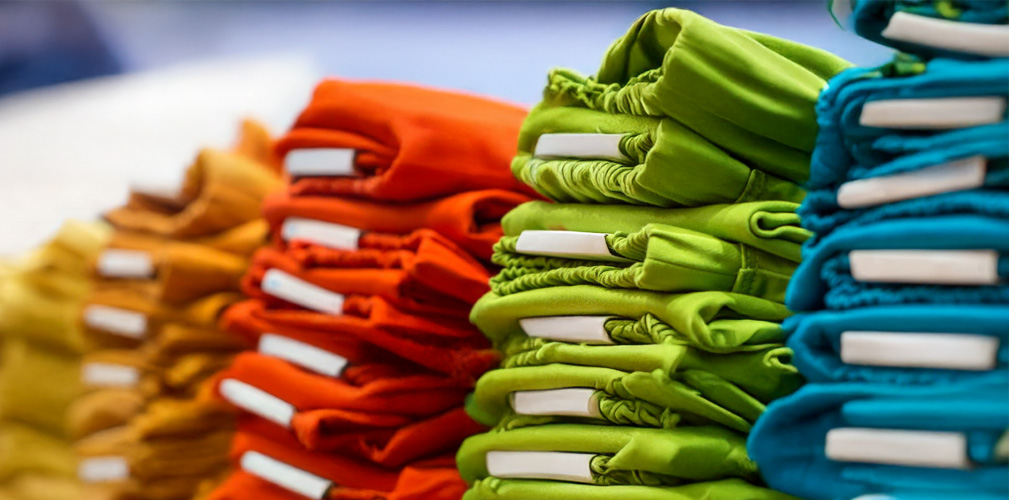 Retail apparel with barcode labels applied before shipment